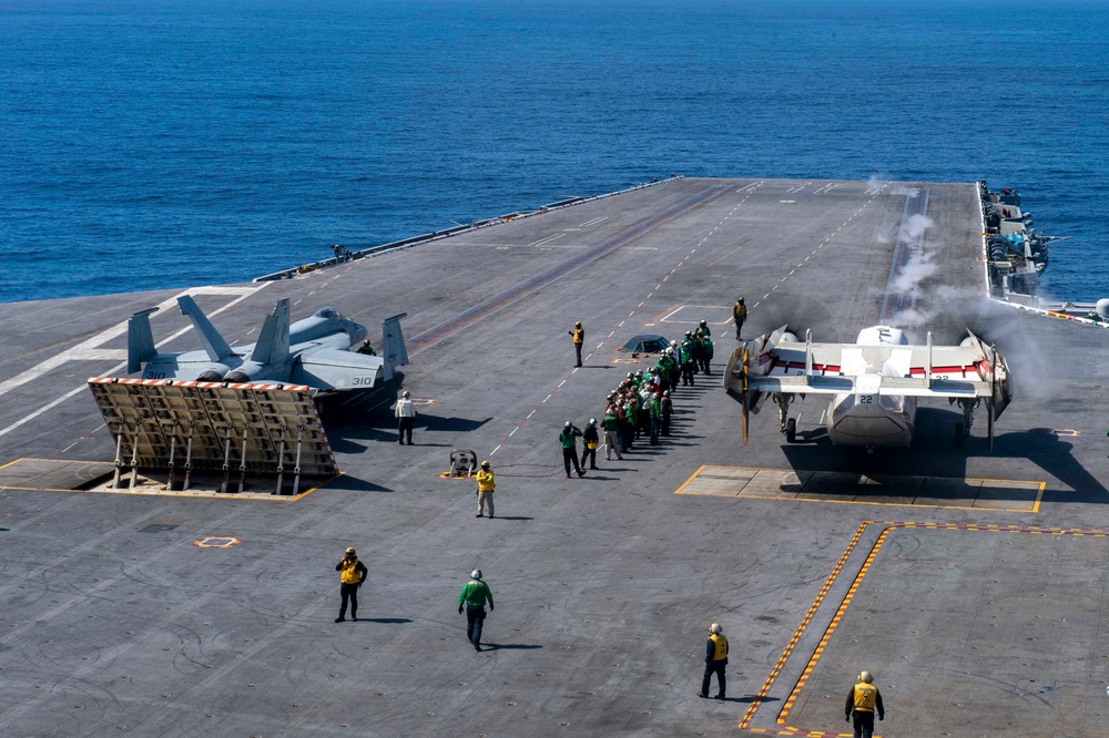 F/A-18F And C-2 Greyhound Prepare To Launch From The Flight Deck