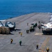 F/A-18F And C-2 Greyhound Prepare To Launch From The Flight Deck