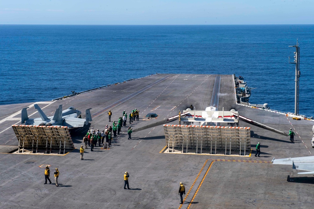 F/A-18F And C-2 Greyhound Prepare To Launch From The Flight Deck