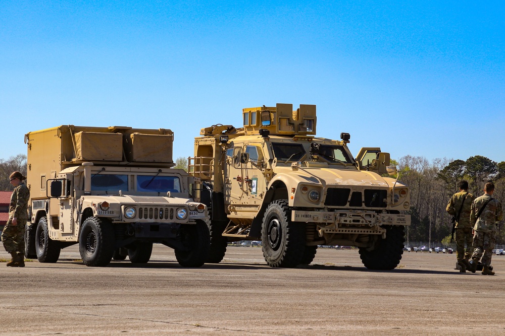 Service members load equipment for a deployment Europe