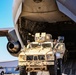 Service members load equipment for a deployment Europe