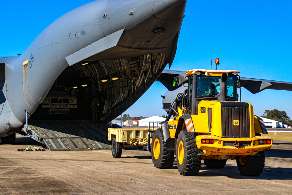 Service members load equipment for a deployment Europe