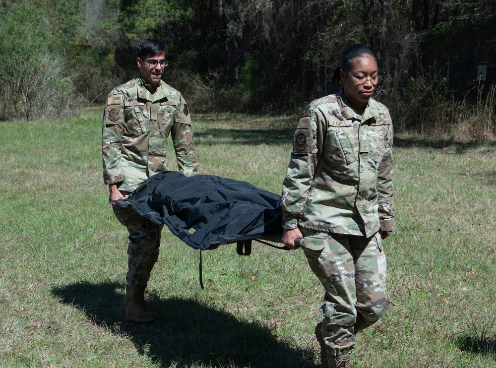 23rd Force Support Squadron Airmen carry a simulated casualty during Exercise Ready Tiger 22-01