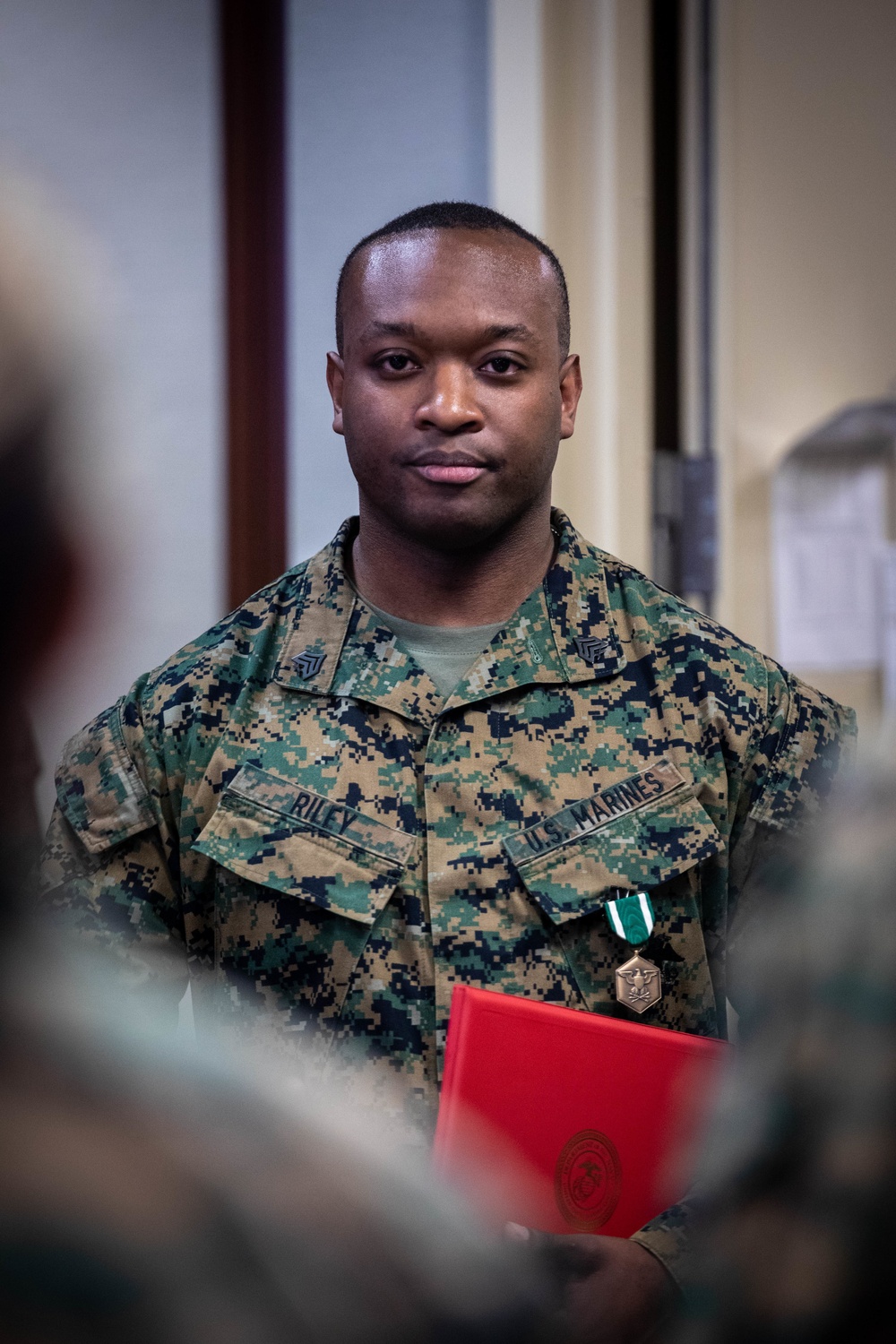 Commander of Marine Forces Reserve awards Navy Commendation Medal to Sgt. Joshua Riley