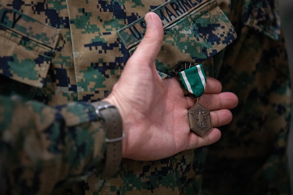 Commander of Marine Forces Reserve awards Navy Commendation Medal to Sgt. Joshua Riley