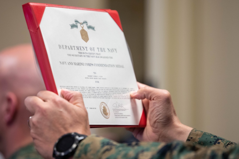 Commander of Marine Forces Reserve awards Navy Commendation Medal to Sgt. Joshua Riley