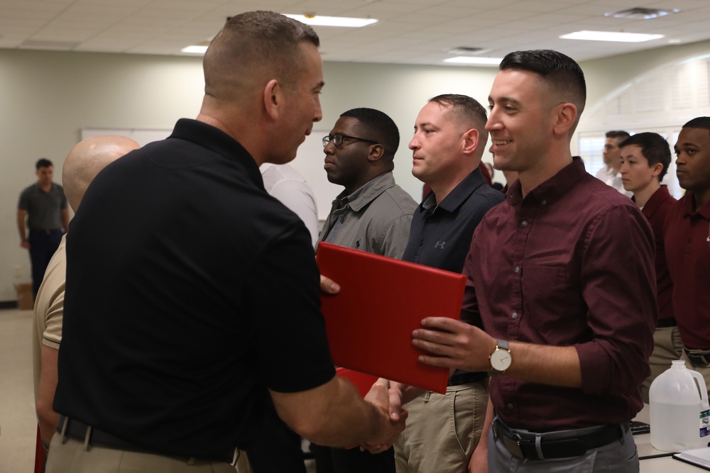 U.S. Marine Recruiters with Recruiting Station Baton Rouge are awarded by 6th Marine Corps District Commanding Officer