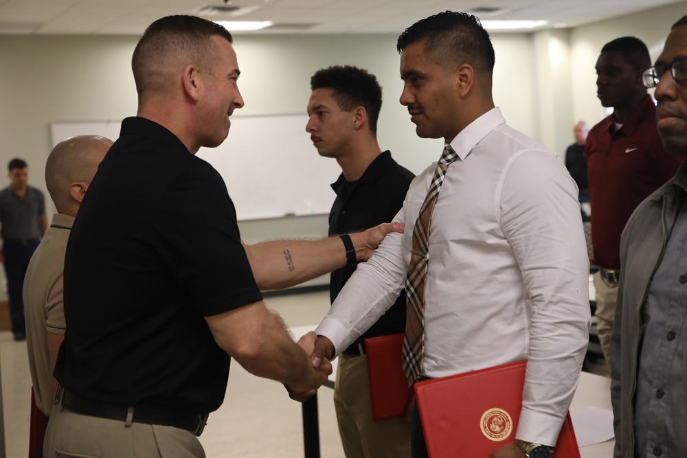 U.S. Marine Recruiters with Recruiting Station Baton Rouge are awarded by 6th Marine Corps District Commanding Officer