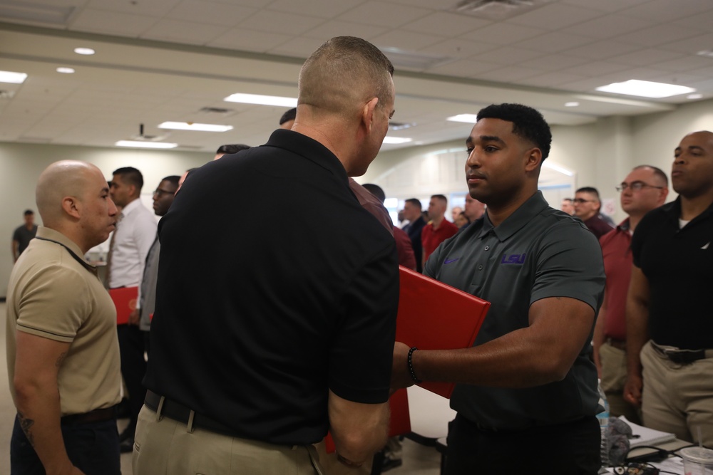 U.S. Marine Recruiters with Recruiting Station Baton Rouge are awarded by 6th Marine Corps District Commanding Officer