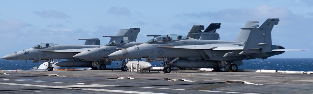 F/A-18F Super Hornet And F/A-18E Super Hornets Rest On The Flight Deck