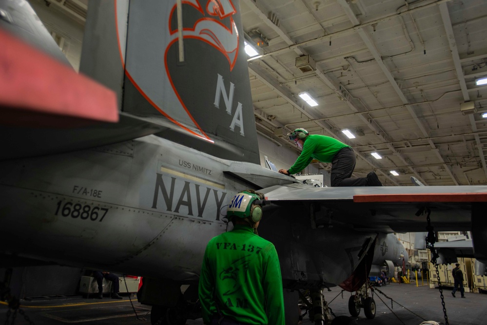 Sailors Conduct Maintenance On An F/A-18E Super Hornet