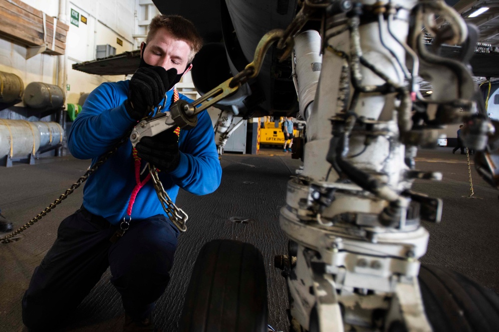 Sailor Chains Down A Firefighting Training Jet