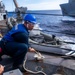 Sailors Aboard USS Ralph Johnson (DDG 114) Conduct Replenishment-at-Sea with USNS Carl Brashear (T-AKE-7)