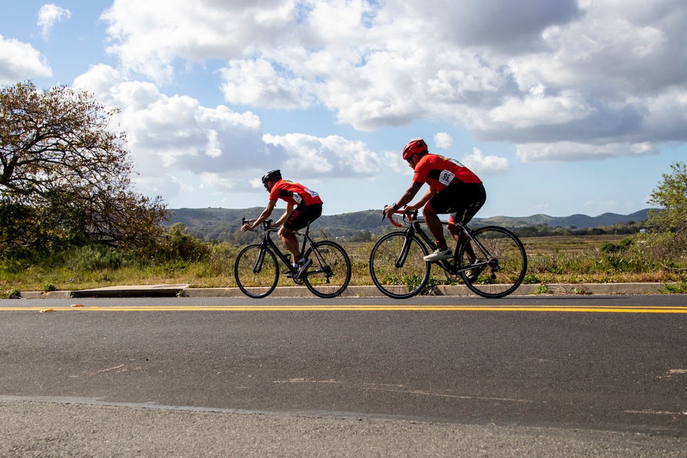 U.S. Marines with Wounded Warrior Regiment compete in the Marine Corps Trails cycling competition