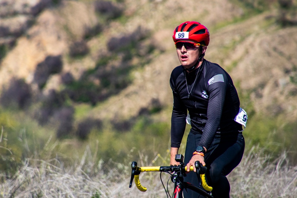 U.S. Marines with Wounded Warrior Regiment compete in the Marine Corps Trails cycling competition