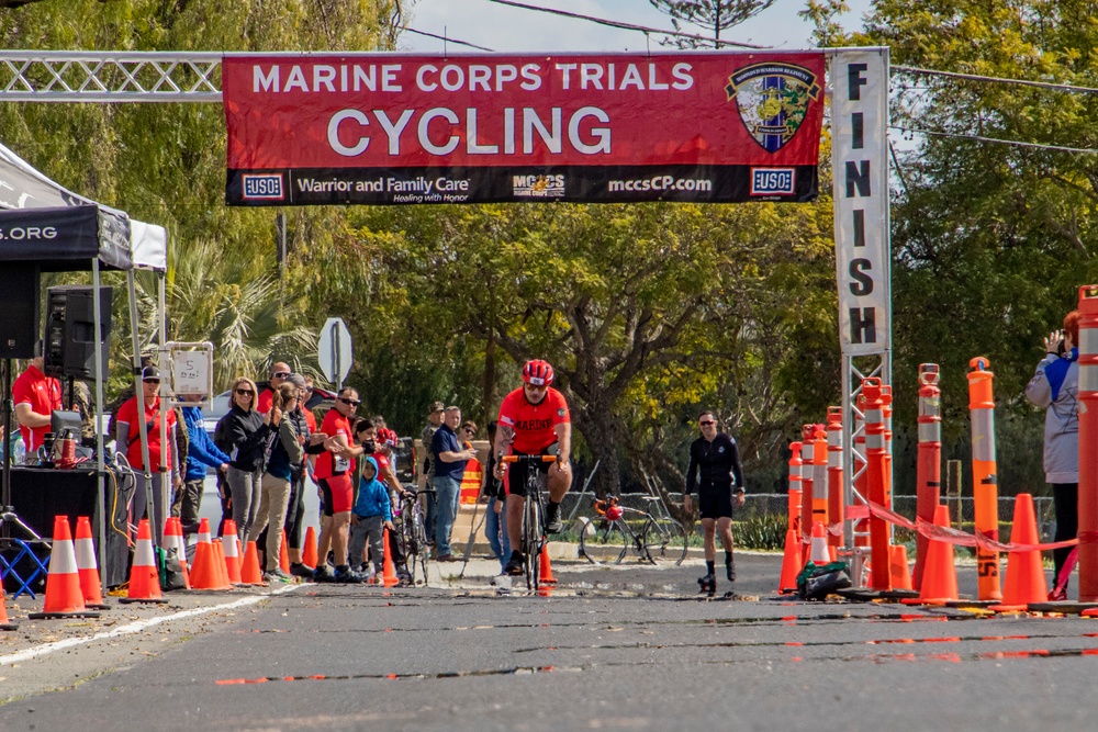 U.S. Marines with Wounded Warrior Regiment compete in the Marine Corps Trails cycling competition