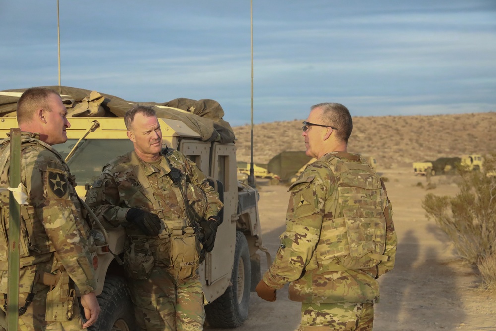 Lt. Gen. Robert &quot;Pat&quot; White, commanding general of III Corps, discusses unit readiness and mission capabilities with Col. Thomas Smith during National Training Center Rotation (22-04)