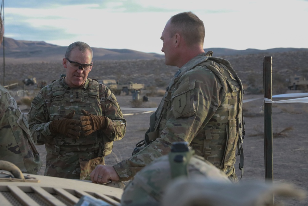 Lt. Gen. Robert &quot;Pat&quot; White, commanding general of III Corps, discusses unit readiness and mission capabilities with Col. Thomas Smith during National Training Center Rotation (22-04)