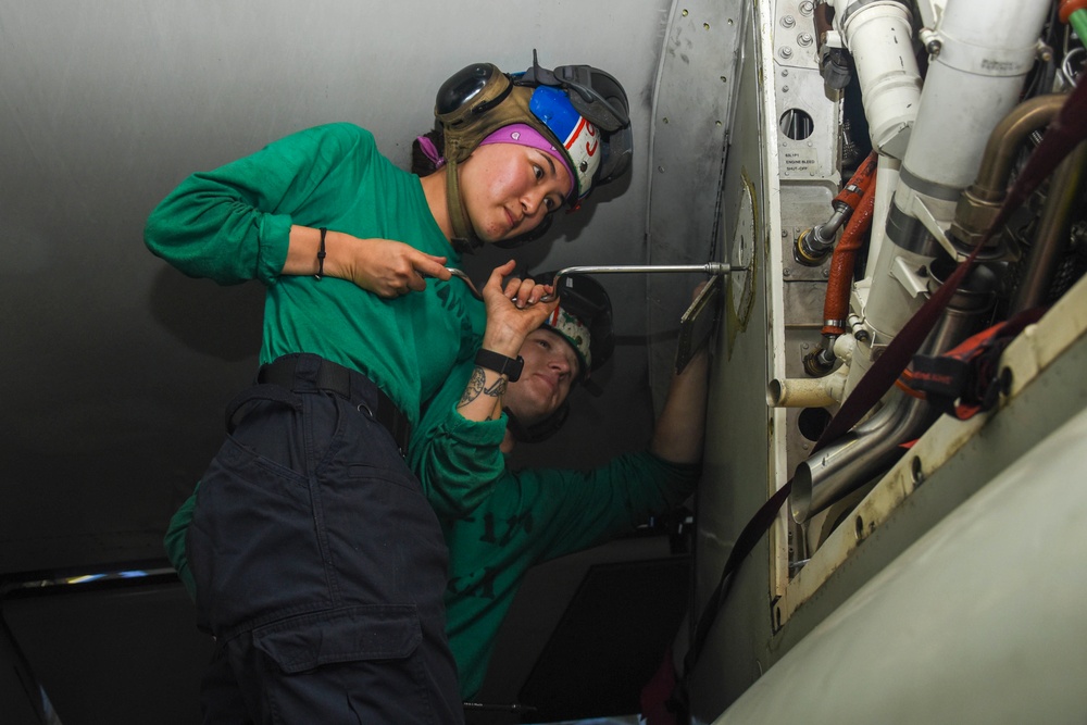 Abraham Lincoln Sailors conduct aircraft maintenance