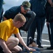 Cryptologic Technician (Collection) Seaman Apprentice Hadyn Randall, left, from Commercial Point, Ohio, participates in the sentry Oleoresin Capsaicin (OC) practical course