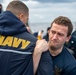 Sonar Technician (Surface) 3rd Class Joseph Brown, right, from Providence, R.I., participates in the sentry Oleoresin Capsaicin (OC) practical course