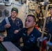 Chief Electrician’s Mate Jay Bosch, left, from Rochester, N.Y., Electricians Mate 1st Class Winston Trinidad, center, from Manila, Philippines, and Chief Gas Turbine Systems Technician (Mechanical) Hong Liang, from Cary, N.C., review casualty alarms.