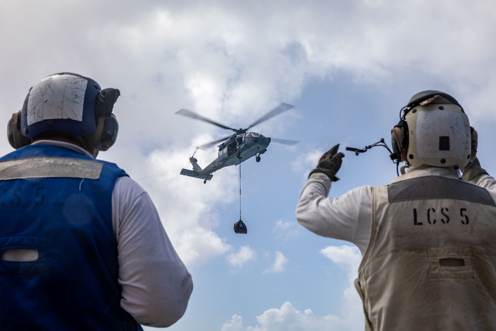 USS Milwaukee Conducts A Vertical Replenishment