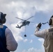 USS Milwaukee Conducts A Vertical Replenishment