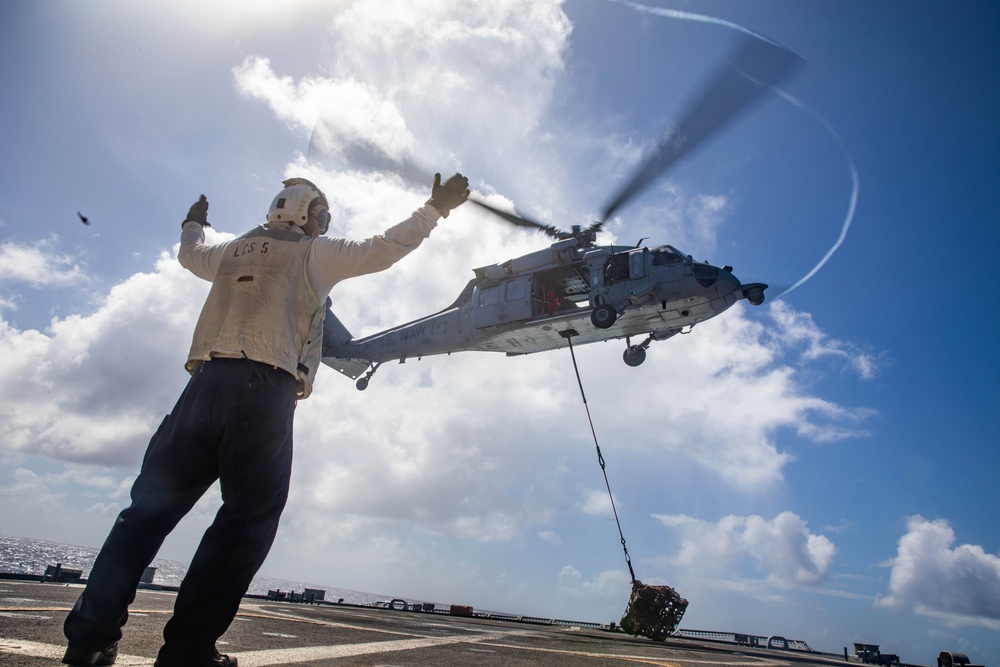 USS Milwaukee Conducts A Vertical Replenishment