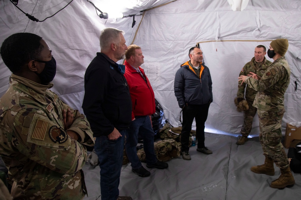 Distinguished visitors receive a brief in mobile medical tent capabilities during Arctic Eagle-Patriot 2022