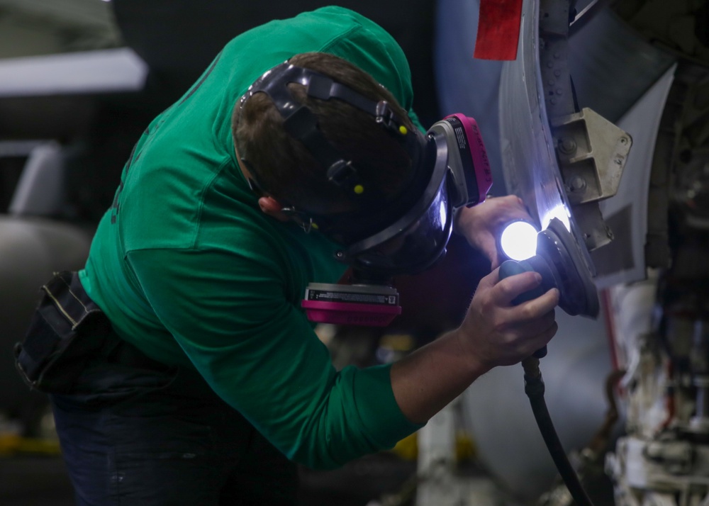 Abraham Lincoln Sailors conduct aircraft maintenance