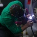 Abraham Lincoln Sailors conduct aircraft maintenance