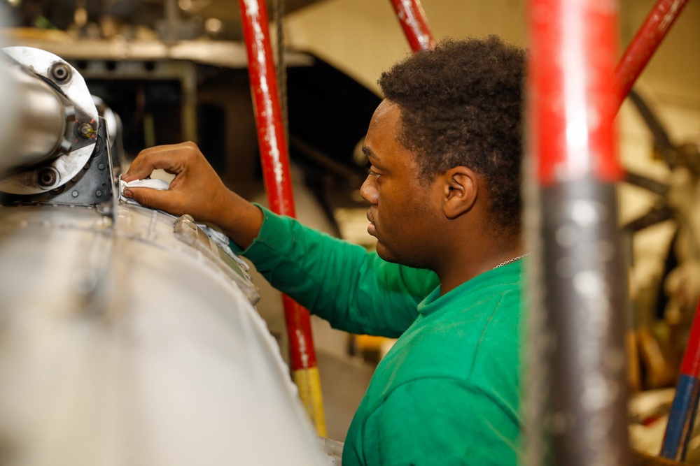 Abraham Lincoln Sailors conduct aircraft maintenance