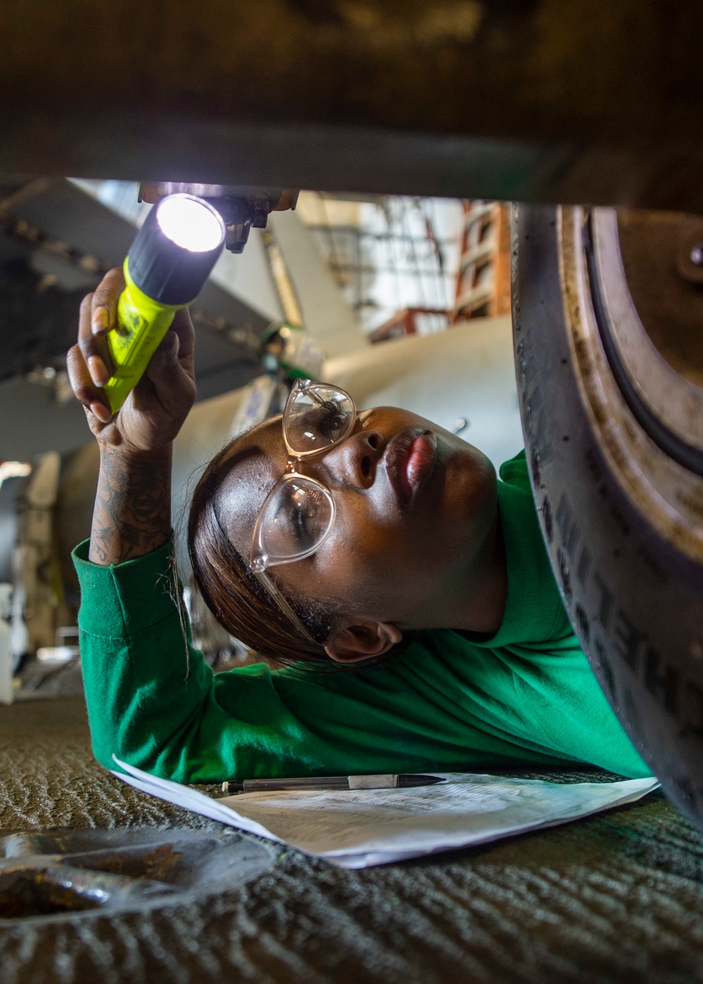 GHWB Sailor Inspects Aircraft
