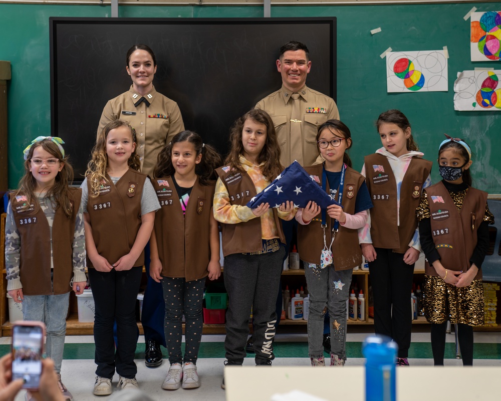 U.S. Marines Conduct Flag Folding For Girl Scouts Troop 3367