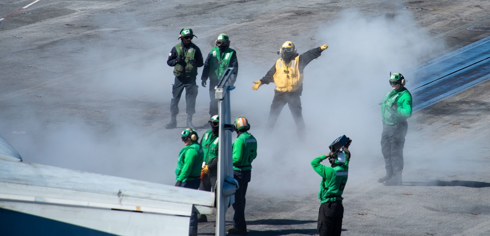 Sailors Direct Jet On The Flight Deck