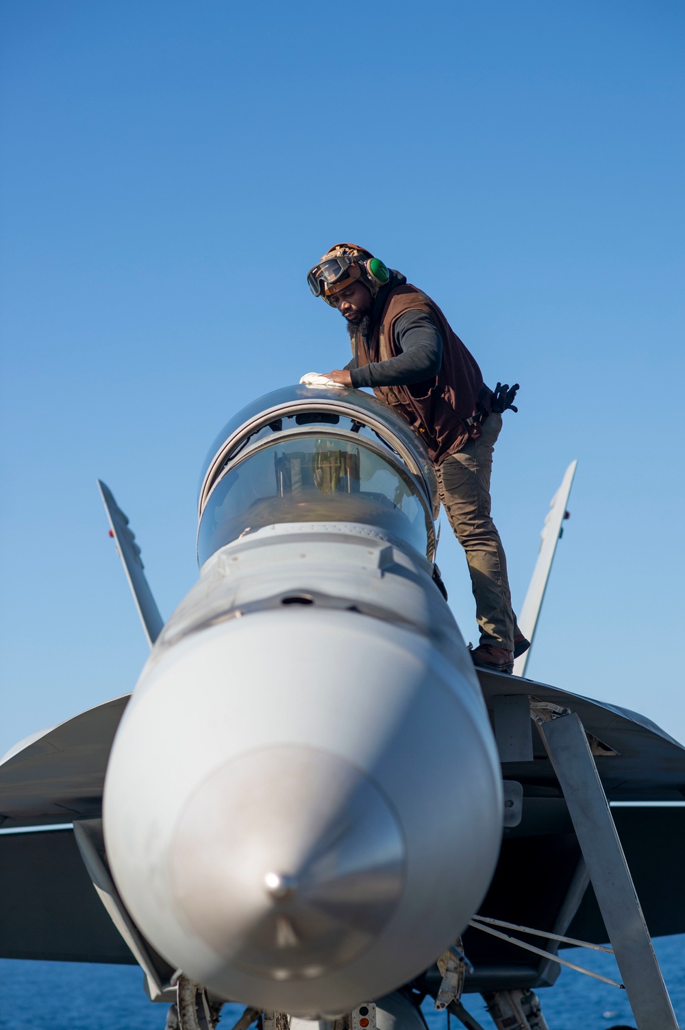 Sailor Conducts Maintenance On An F/A-18F Super Hornet