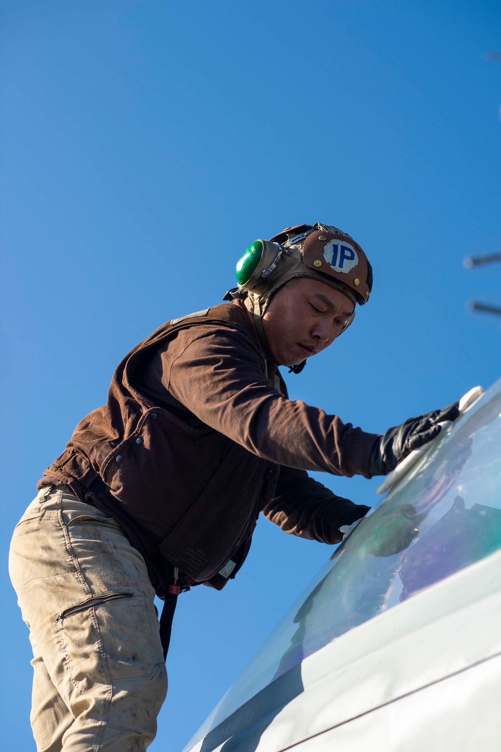 Sailor Conducts Maintenance On An F/A-18F Super Hornet