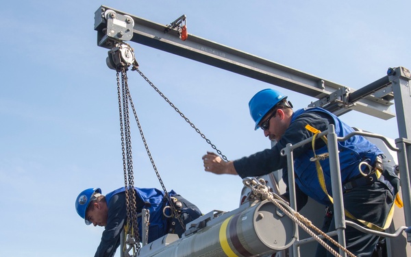 GHWB Sailors Load Ordnance for RAM