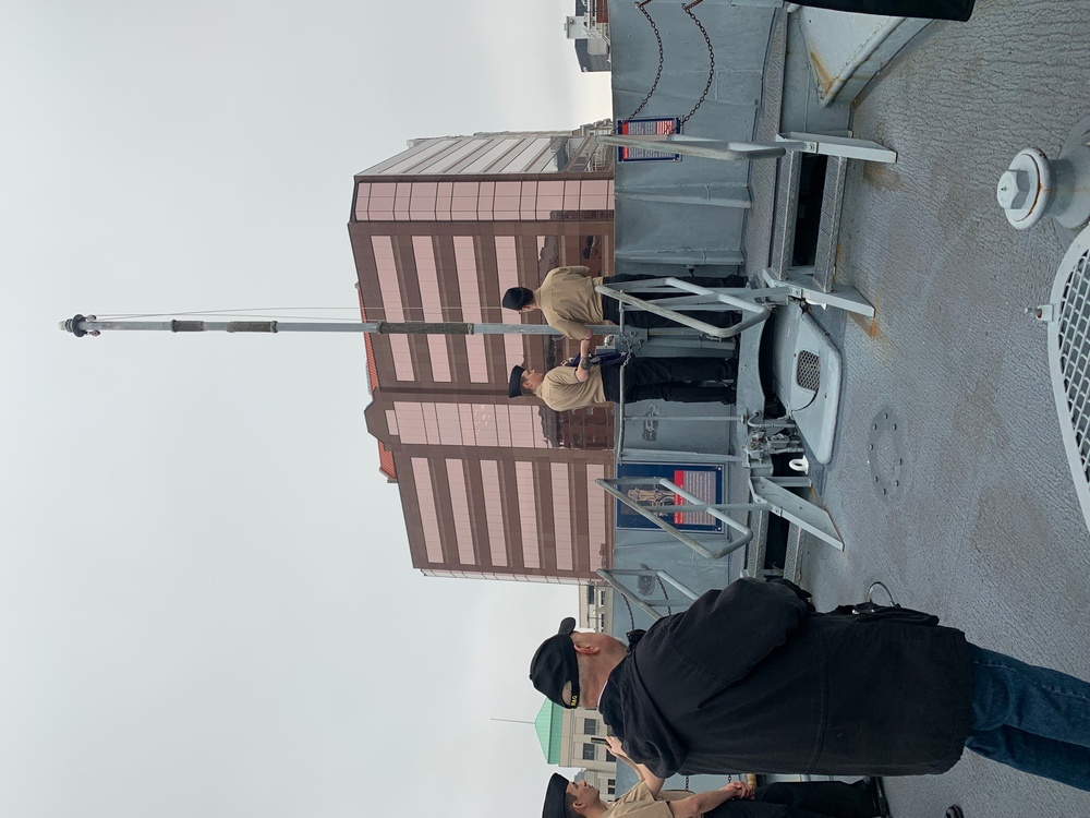 Raising the Navy jack on Battleship Wisconsin