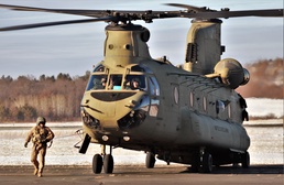 Crew guides CH-47 Chinook for sling-load training support at Fort McCoy