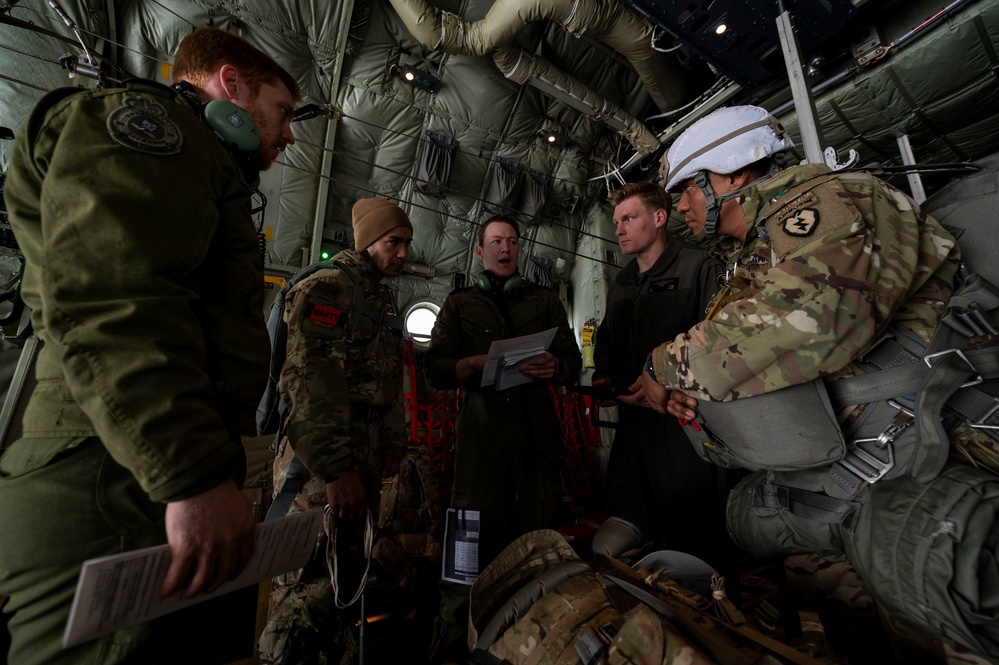 U.S. Army paratroopers jump out of RCAF CC-130J during JPMRC 22-02
