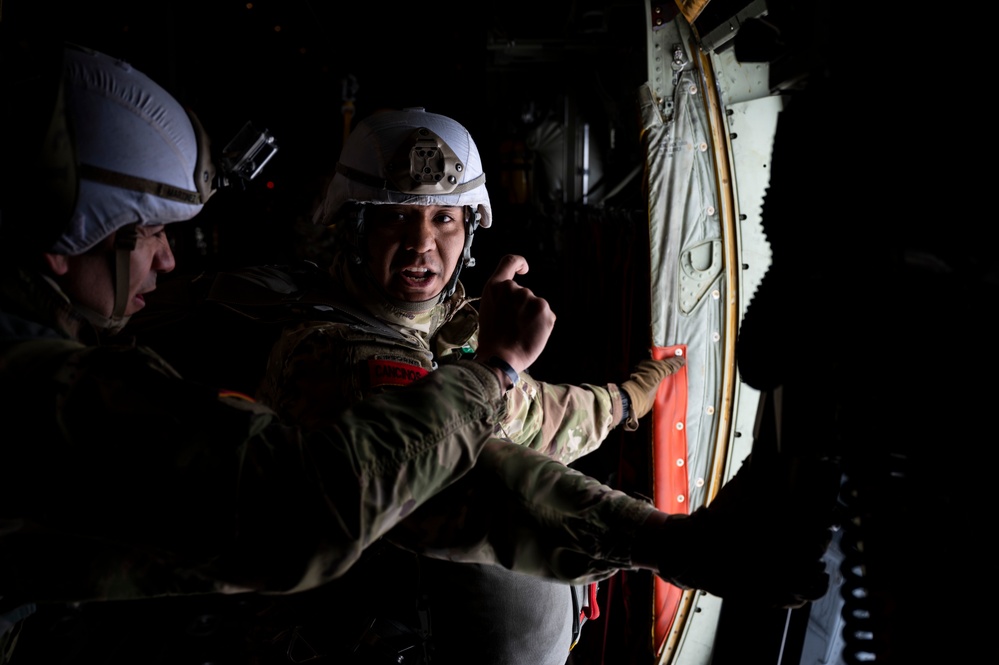 U.S. Army paratroopers jump out of RCAF CC-130J during JPMRC 22-02