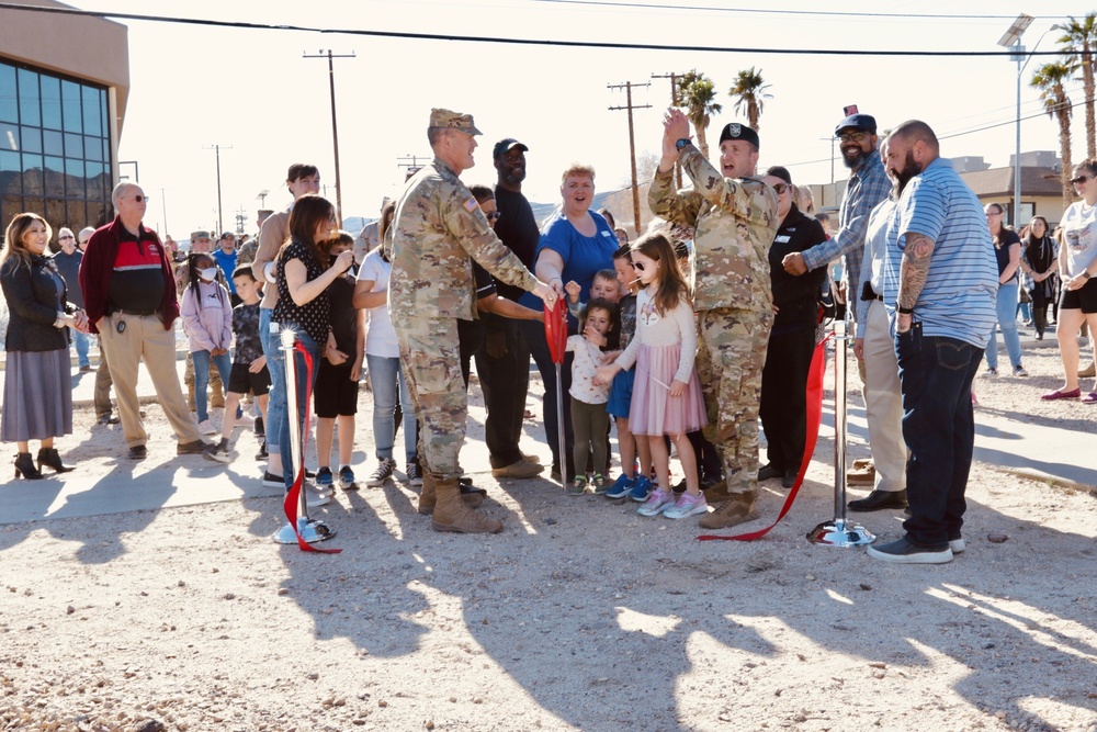 Brig. Gen. Curt Taylor and Col. Jason Clarke celebrate the library grand opening with community members