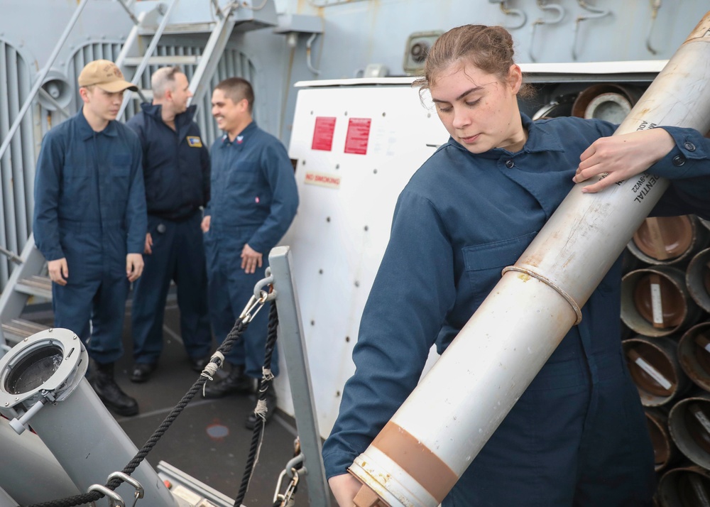 Cryptologic Technician Carries Chaff Canister