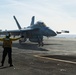 A Sailor Directs An Aircraft