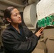 Abraham Lincoln Sailors inspect alarm switchboard