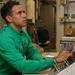 Abraham Lincoln Sailors inspect alarm switchboard