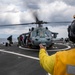 Sailors aboard Arleigh Burke-class guided-missile destroyer USS Mitscher (DDG 57) conduct a personnel transfer with an MH-60S Sea Hawk helicopter assigned to the “Dragon Slayers” of Helicopter Sea Combat Squadron (HSC) 11
