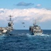 Nimitz-class aircraft carrier USS Harry S. Truman (CVN 75) conducts a vertical replenishment with Supply-class fast combat support ship USNS Supply (T-AOE-6)